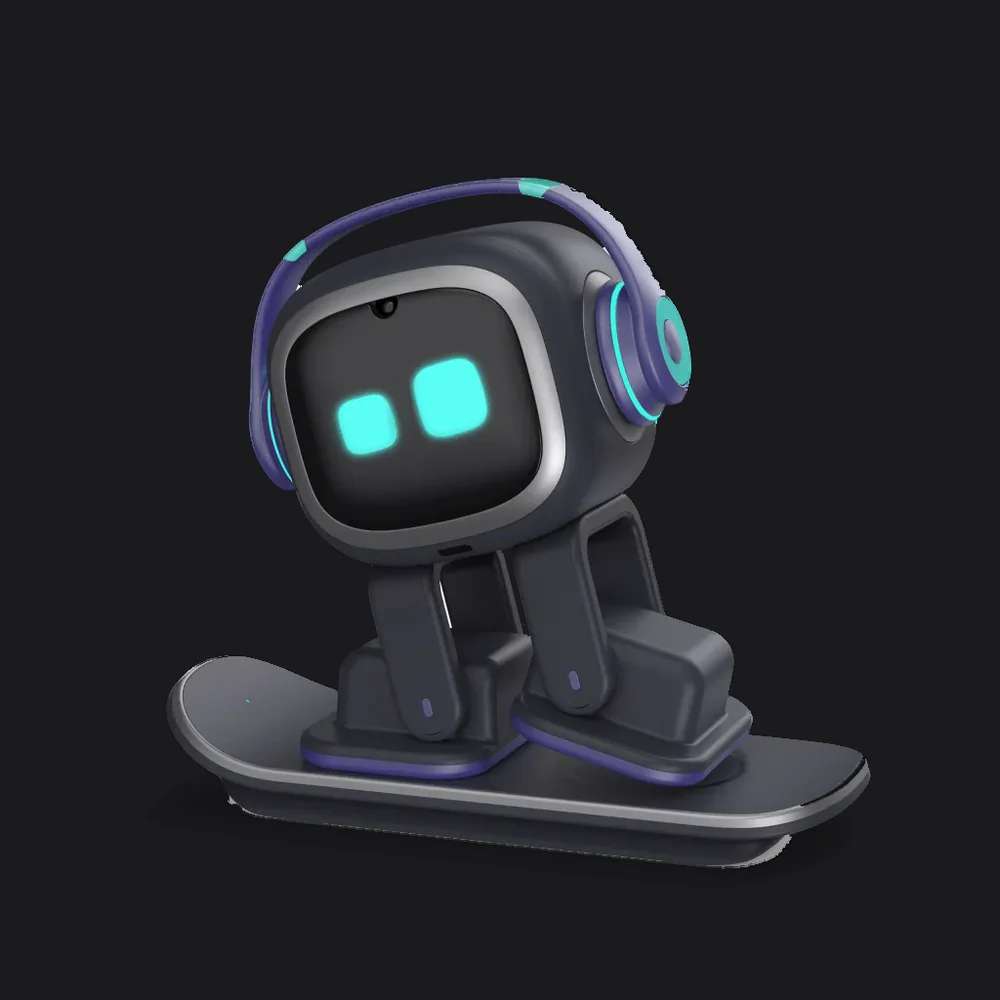 The EMO desktop robot standing on its skateboard charger, wearing its signature headphones